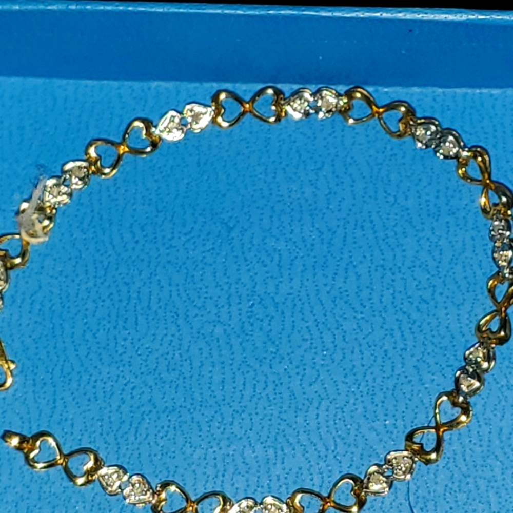 10k yellow gold and diamond MGM bracelet